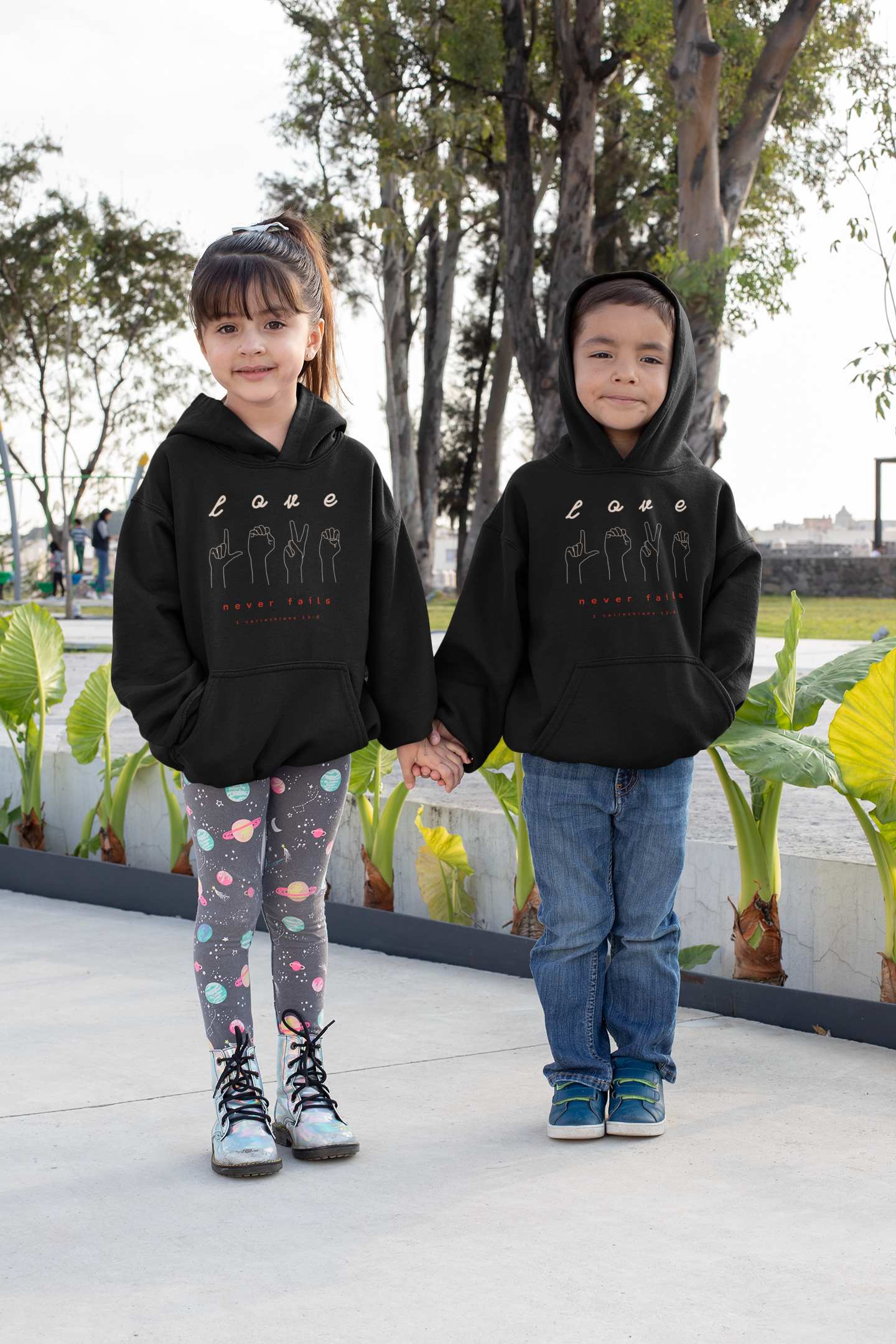 Black "Love never fails" kids christian hooded sweatshirt
